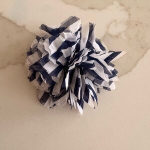 Fabric flower that can be used as a hair accessory or a lapel pin